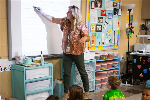 Students inside their classrooms learning. 